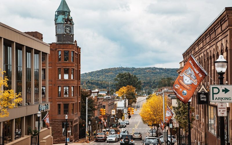 Downtown Marquette, Michigan, as seen from North Front Street in autumn, with a Kraft Hockeyville banner.