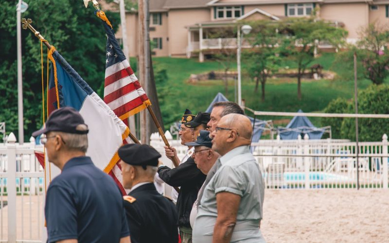 Photo by Craig Adderley: https://www.pexels.com/photo/men-standing-near-flags-1582493/